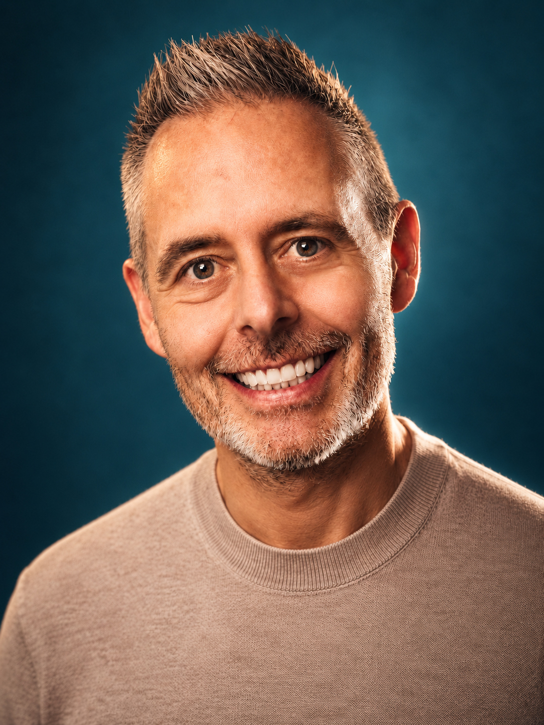 David Kavanagh, founder and creative director of Ballsy.tv, grinning at the camera in a studio portrait